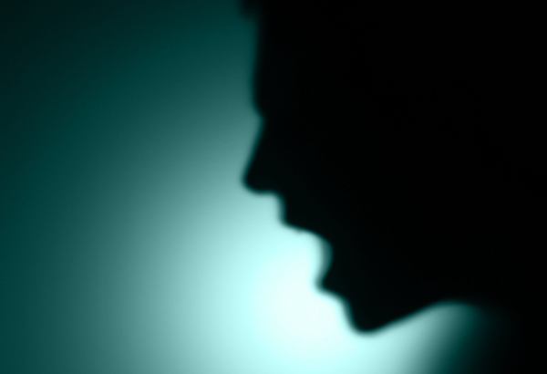 Shadow figure screams with mouth open