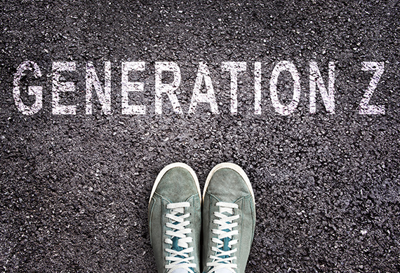 Shoes stand on pavement with Generation Z written above