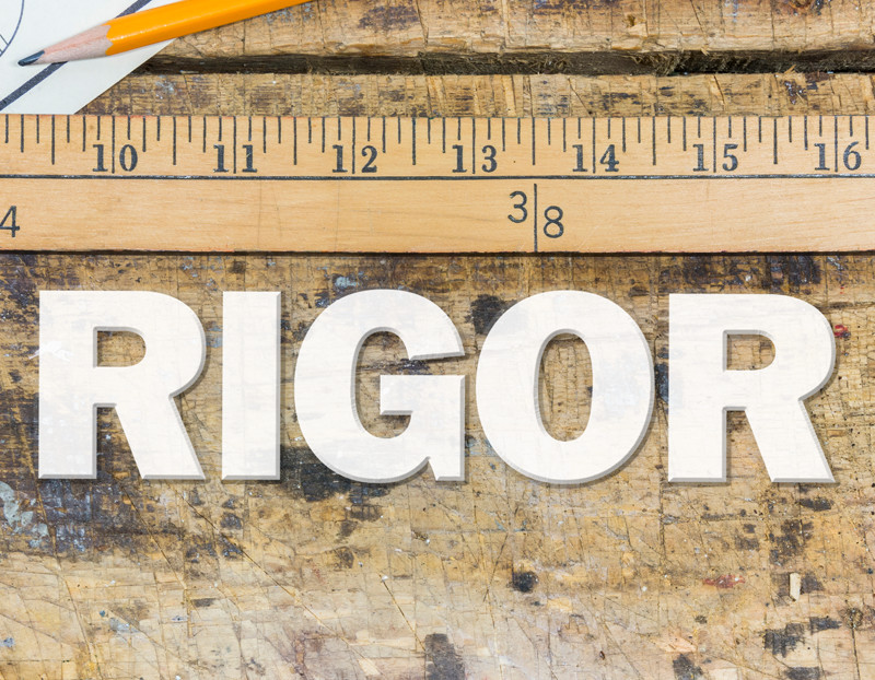 The word "Rigor" is measured by ruler on top of it
