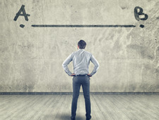 Person stands facing wall with line drawn above with choice A and B on each side of line