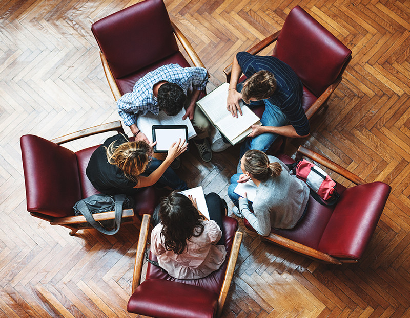 Students bring chairs together for 360 degree assessment