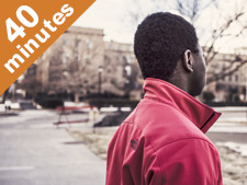 Male student overlooks empty campus