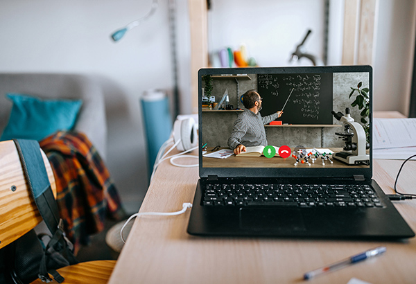 laptop-in-home-with-instructor-at-blackboard-teaching