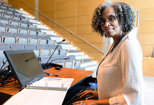 woman-working-in-classroom-at-podium