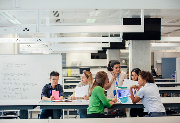 professional-in-classroom-working-with-students