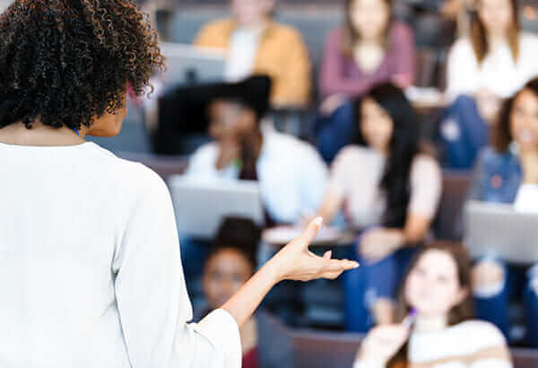 Faculty in front of class content expert